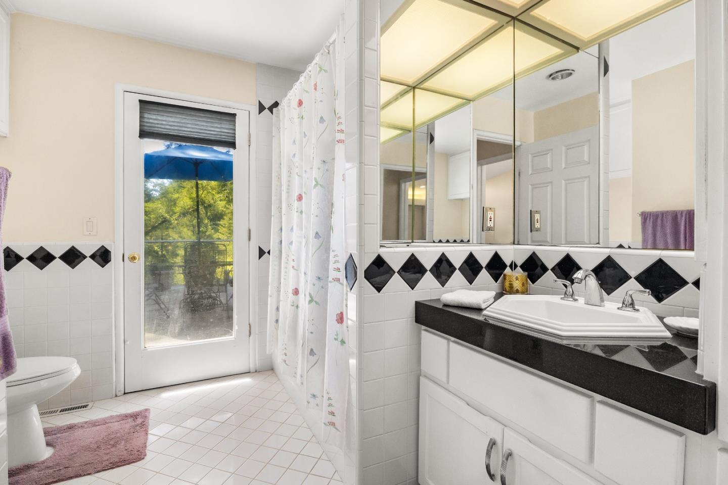 2000 Glen Canyon Road Santa Cruz, CA 95060 - Photo 25 of 41 a bathroom with a granite countertop sink a toilet and shower