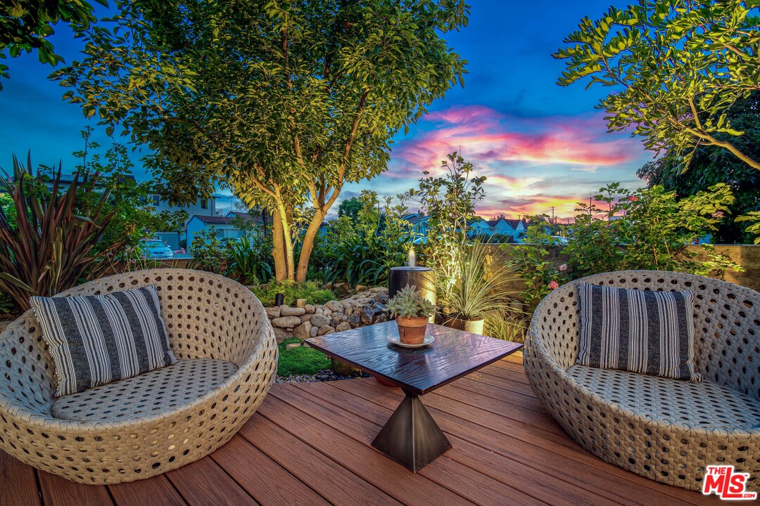 11519 Mississippi Avenue Los Angeles, CA 90025 - Photo 2 of 45 a view of balcony with wooden floor and outdoor seating