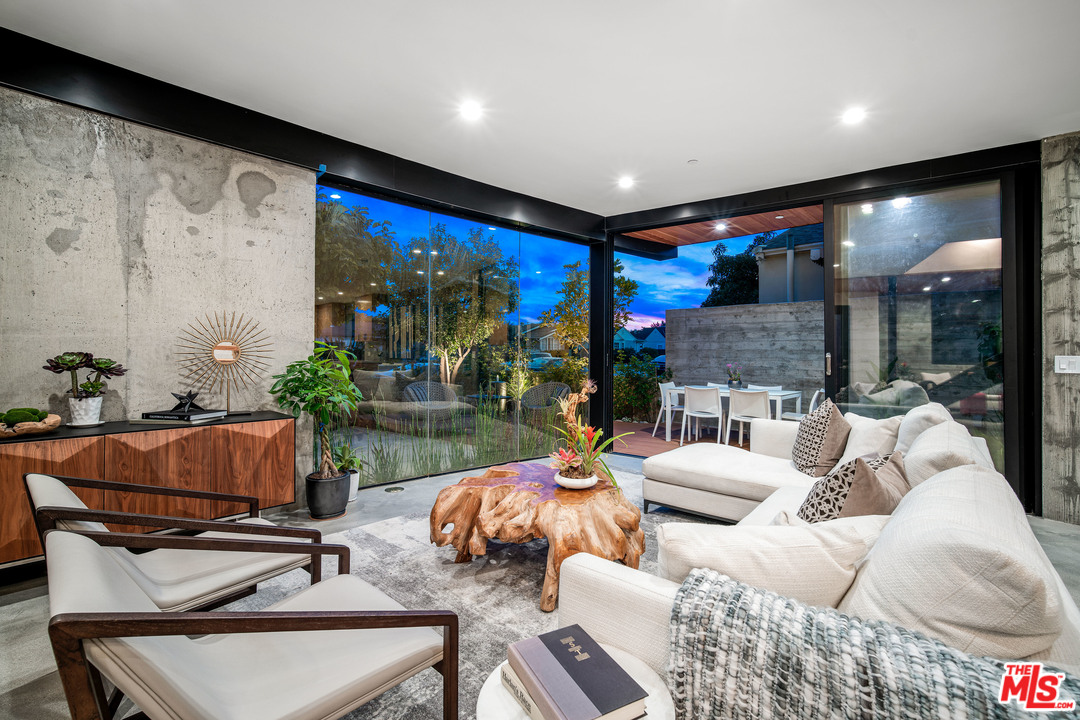 11519 Mississippi Avenue Los Angeles, CA 90025 - Photo 3 of 45 a outdoor living space with furniture potted plant and a large window