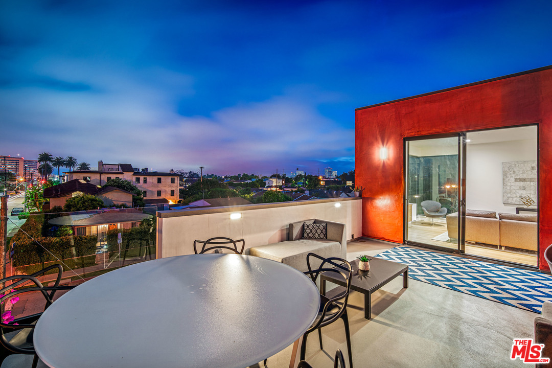 11519 Mississippi Avenue Los Angeles, CA 90025 - Photo 23 of 45 a view of a balcony with furniture and a table
