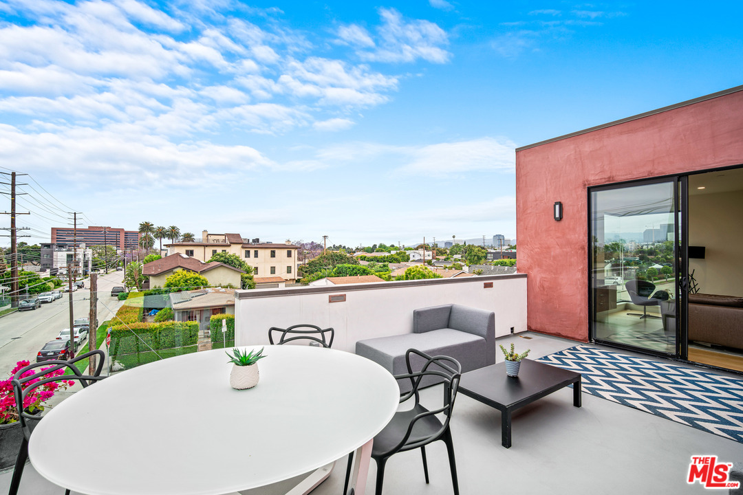 11519 Mississippi Avenue Los Angeles, CA 90025 - Photo 27 of 45 a terrace with outdoor seating and city view