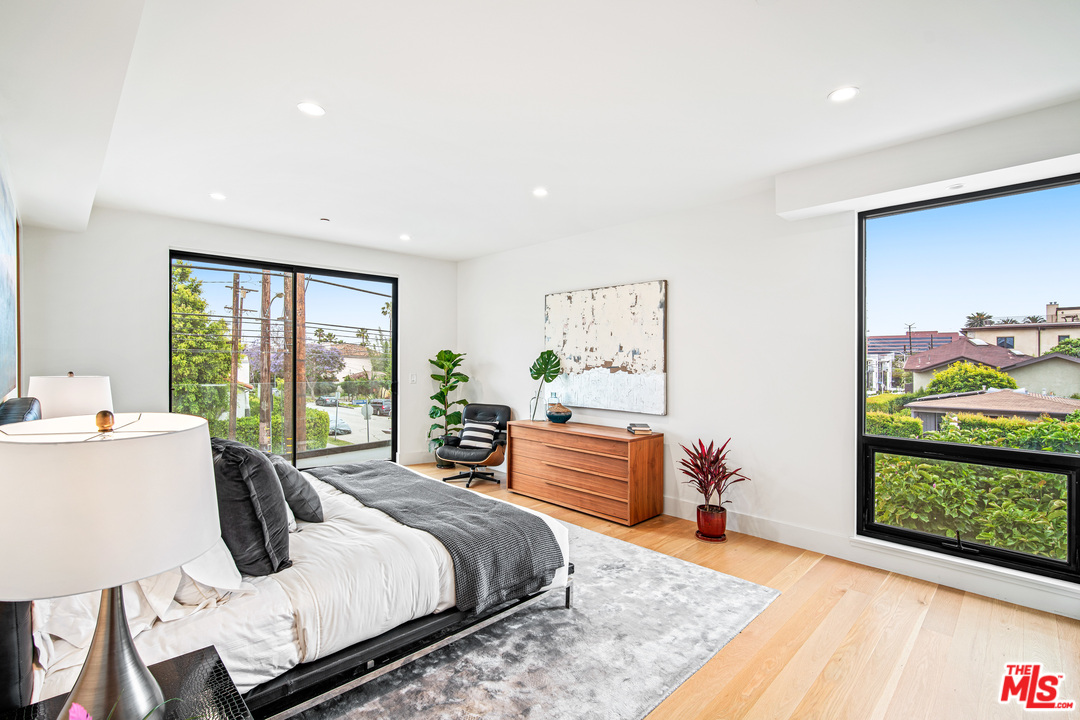 11519 Mississippi Avenue Los Angeles, CA 90025 - Photo 33 of 45 a bedroom with a bed and a dresser next to a window