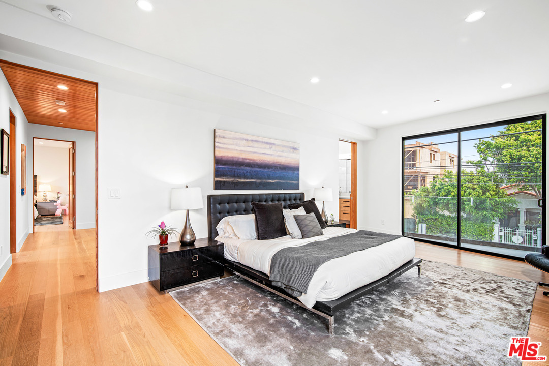 11519 Mississippi Avenue Los Angeles, CA 90025 - Photo 34 of 45 a bedroom with a bed and large window