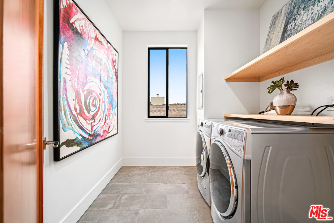 11519 Mississippi Avenue Los Angeles, CA 90025 - Photo 37 of 45 a utility room with dryer and washer