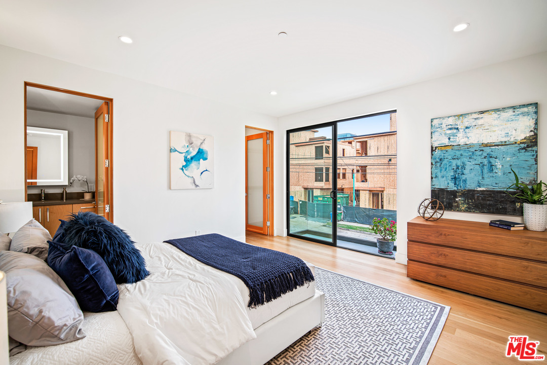 11519 Mississippi Avenue Los Angeles, CA 90025 - Photo 40 of 45 a bedroom with a large bed and a window