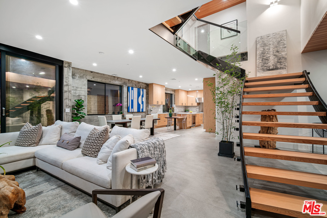 11519 Mississippi Avenue Los Angeles, CA 90025 - Photo 5 of 45 a living room with furniture and a chandelier