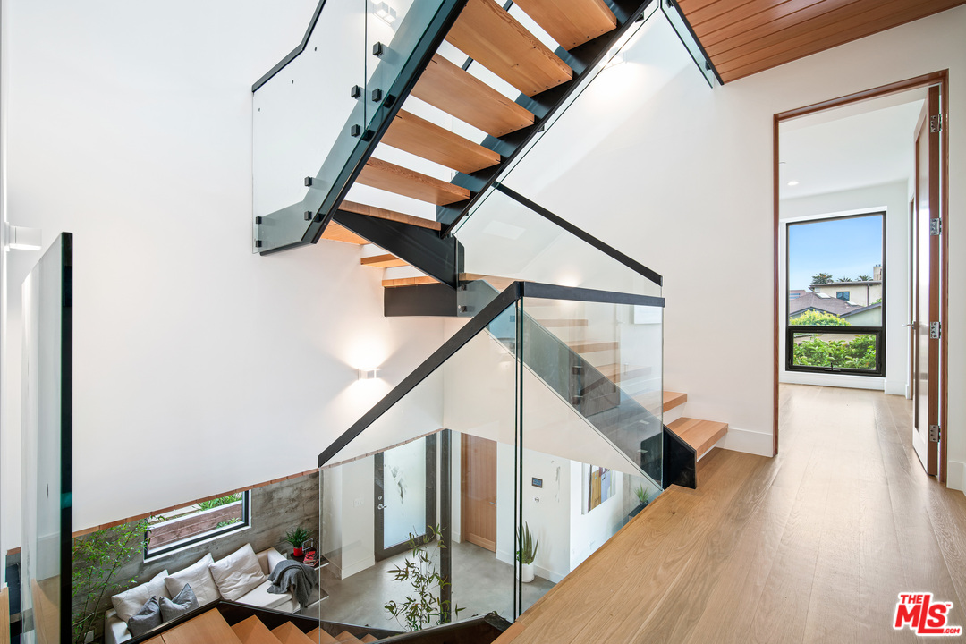 11519 Mississippi Avenue Los Angeles, CA 90025 - Photo 42 of 45 a view of entryway and hall with wooden floor