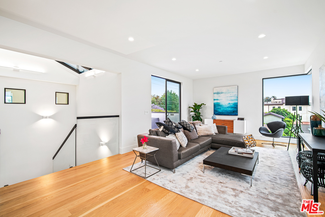 11519 Mississippi Avenue Los Angeles, CA 90025 - Photo 44 of 45 a living room with furniture and a wooden floor