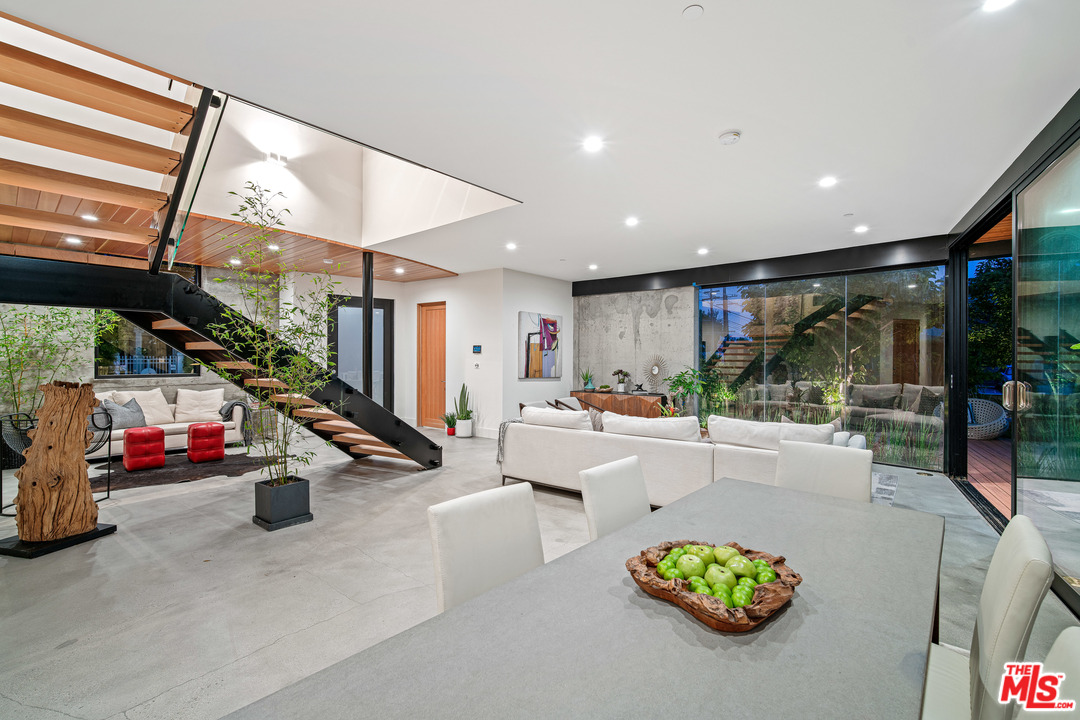 11519 Mississippi Avenue Los Angeles, CA 90025 - Photo 7 of 45 a living room with lots of furniture and a chandelier