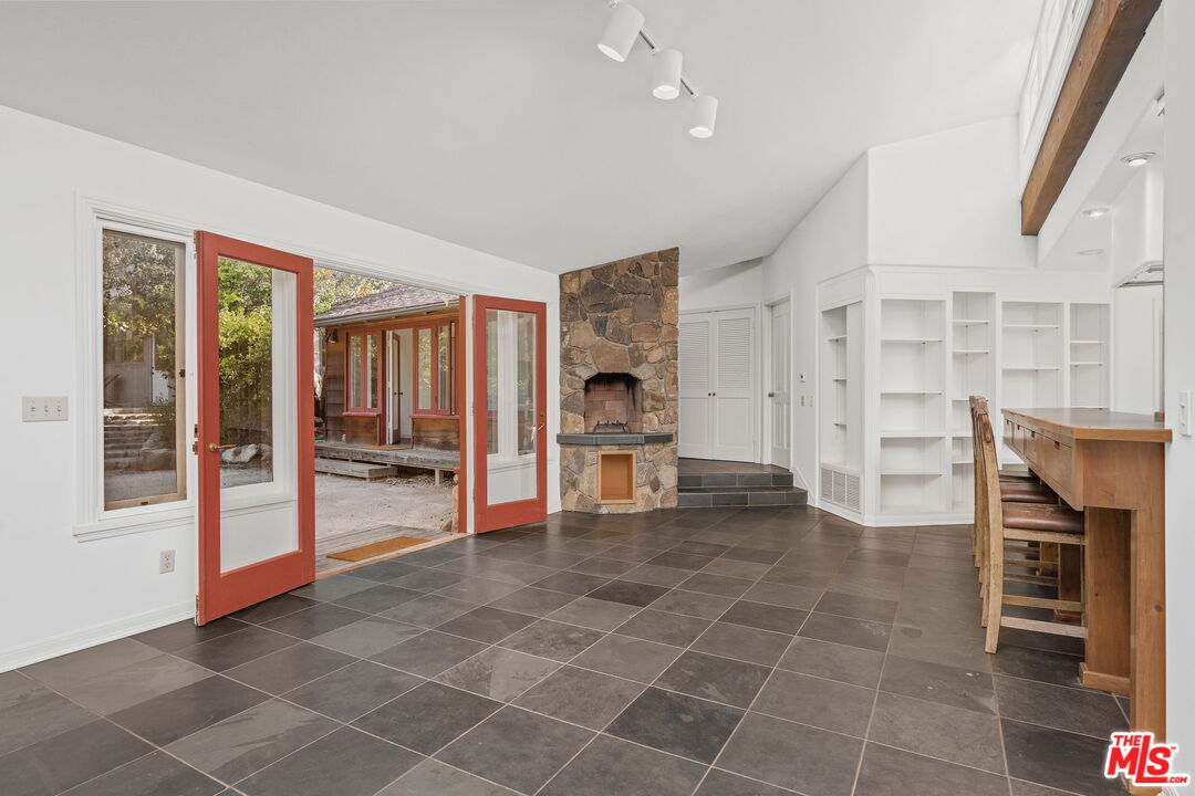 310 McKee Street Ojai, CA 93023 - Photo 12 of 33 a view of a livingroom with an empty space and a fireplace