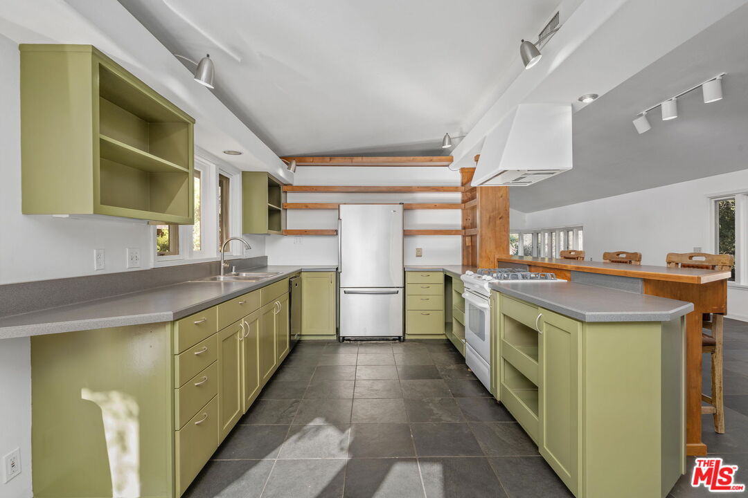 310 McKee Street Ojai, CA 93023 - Photo 16 of 33 a kitchen with a stove and a sink