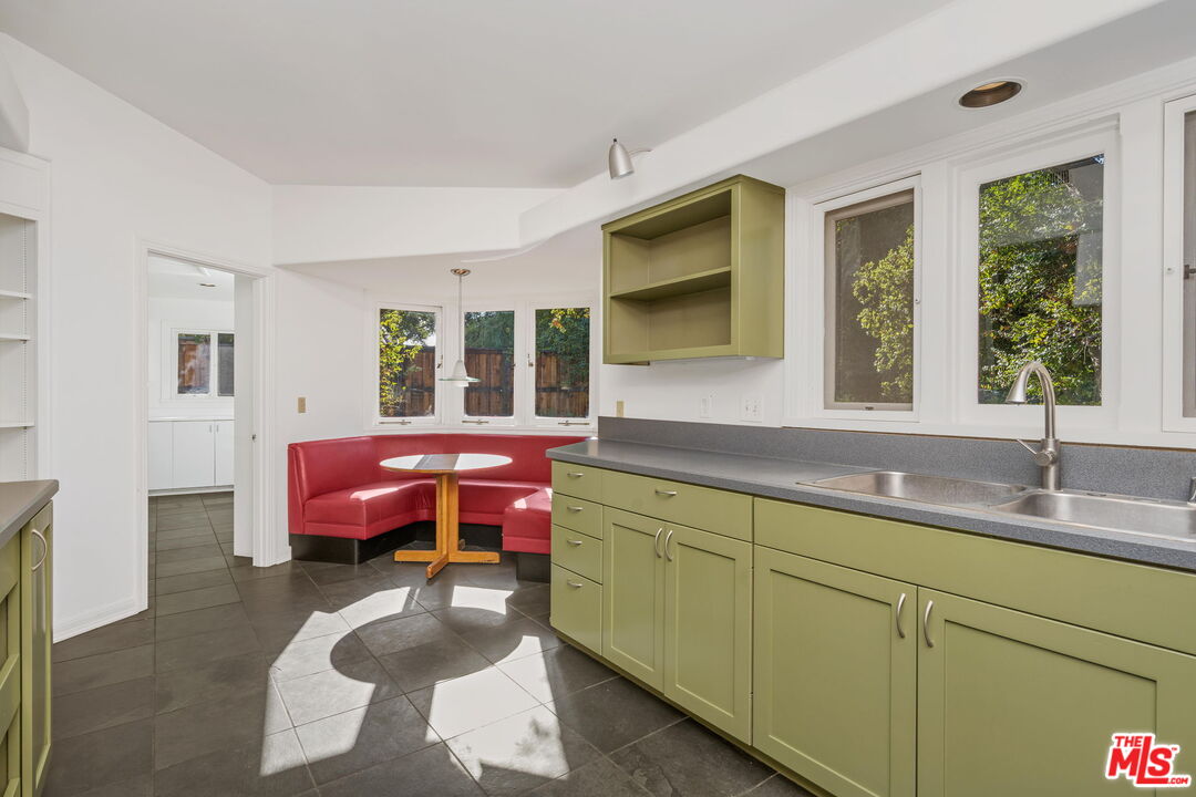310 McKee Street Ojai, CA 93023 - Photo 17 of 33 a spacious bathroom with a granite countertop sink and a mirror