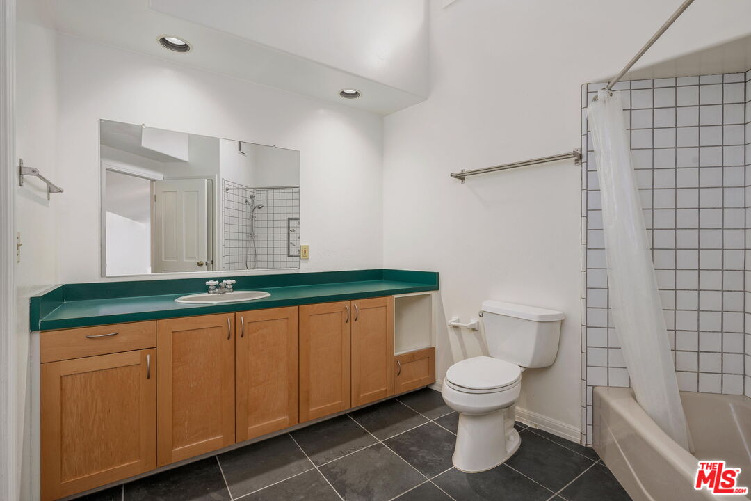 310 McKee Street Ojai, CA 93023 - Photo 23 of 33 a bathroom with a sink a toilet and a shower