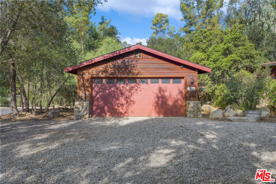 310 McKee Street Ojai, CA 93023 - Photo 4 of 33 a front view of a house with a garden and yard