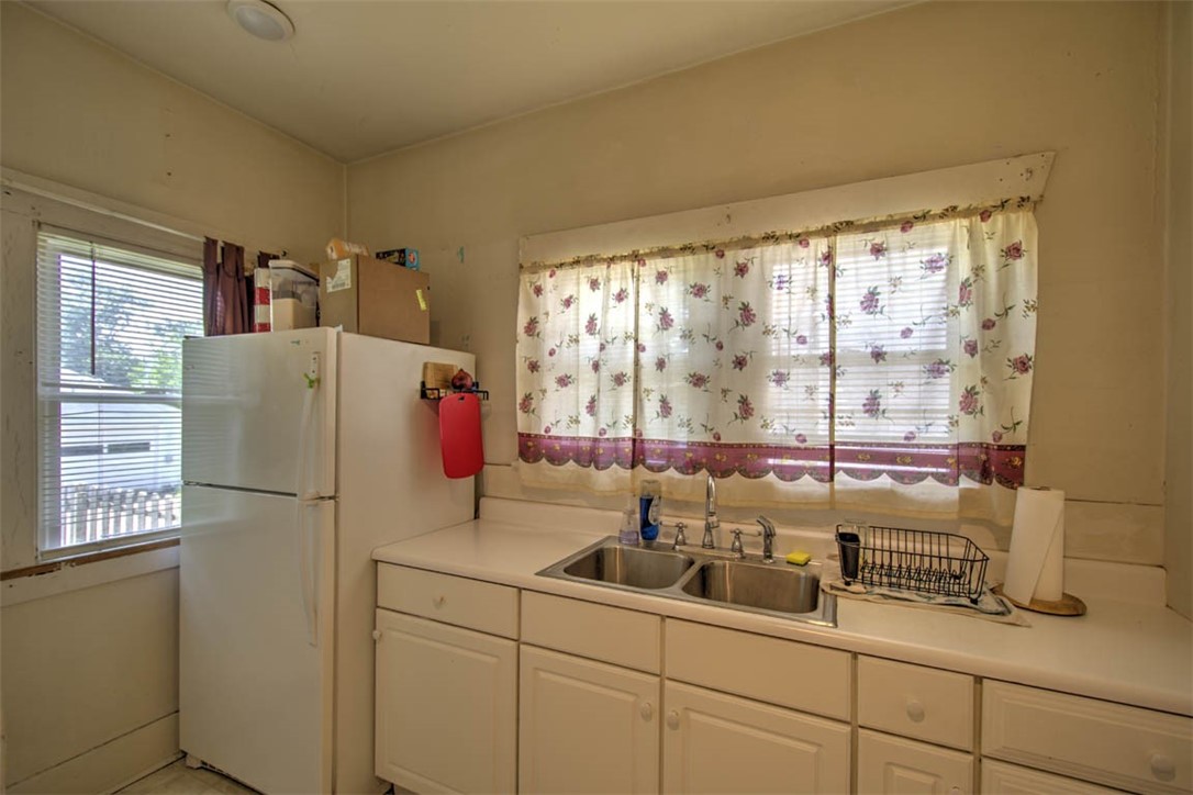 739 West Cushing Street Decatur, IL 62526 - Photo 14 of 28 a kitchen with a refrigerator and a sink