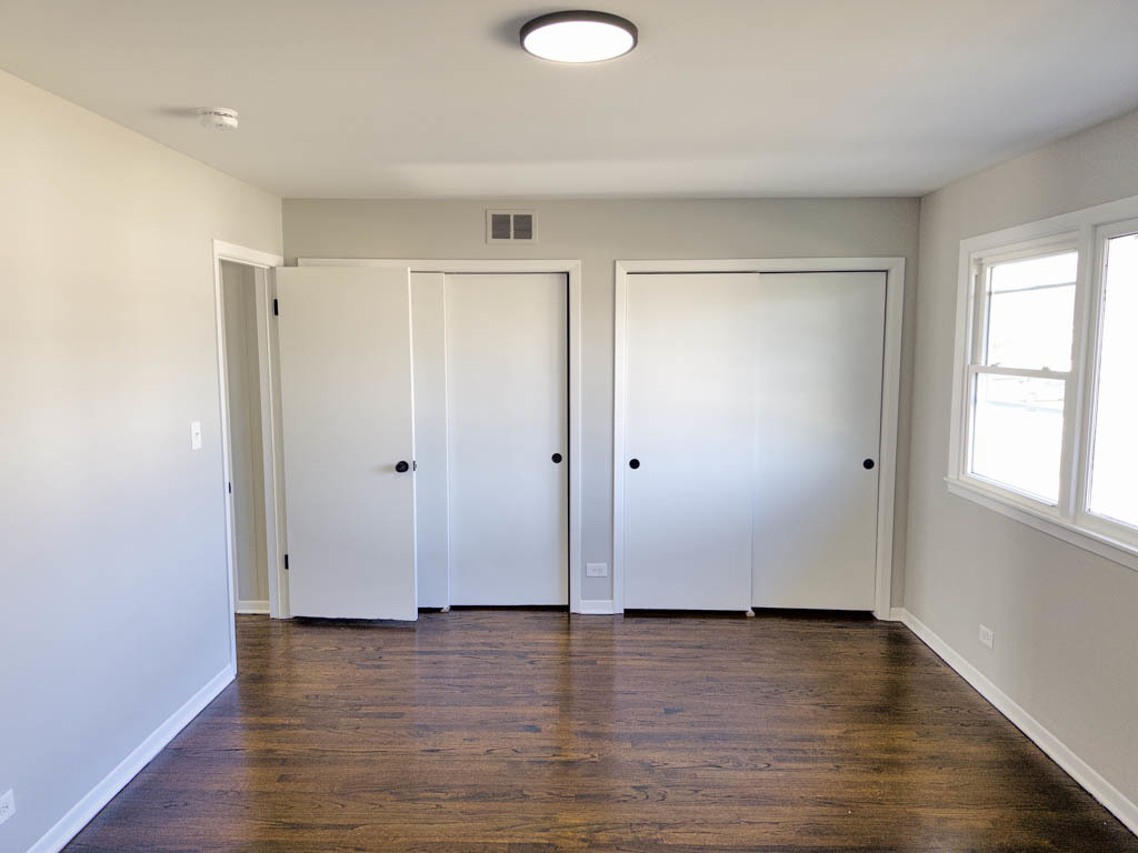 5633 Murray Drive Berkeley, IL 60163 - Photo 13 of 17 an empty room with wooden floor and windows