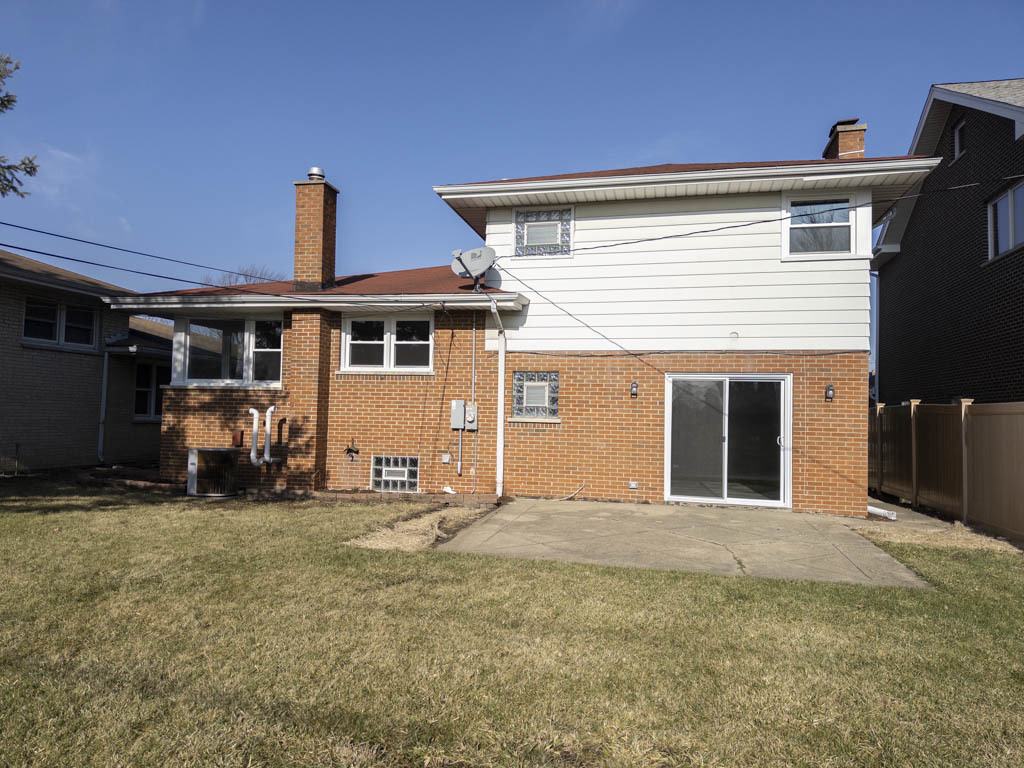 5633 Murray Drive Berkeley, IL 60163 - Photo 14 of 17 a view of a house with backyard and porch