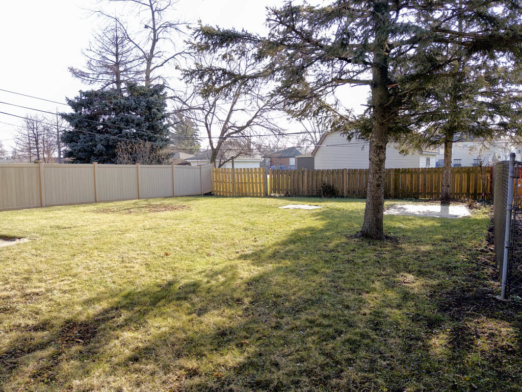 5633 Murray Drive Berkeley, IL 60163 - Photo 16 of 17 a view of a swimming pool with a yard