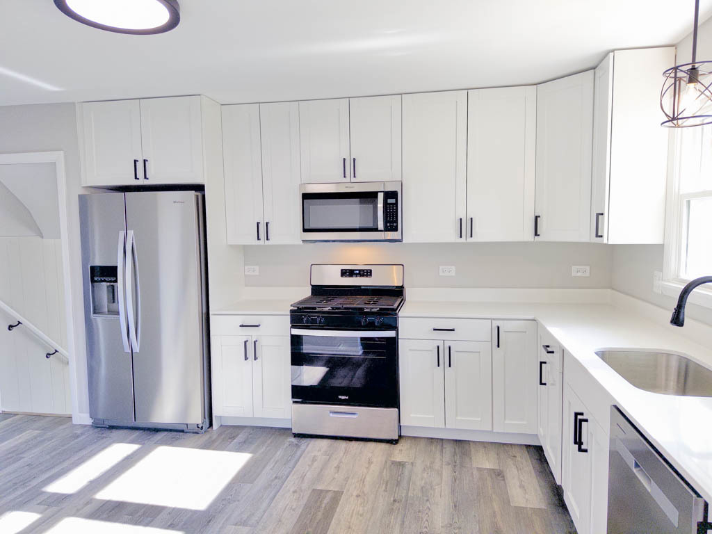 5633 Murray Drive Berkeley, IL 60163 - Photo 2 of 17 a kitchen with a sink stove and refrigerator