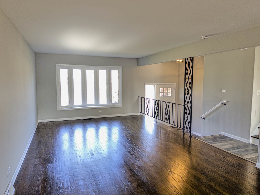 5633 Murray Drive Berkeley, IL 60163 - Photo 4 of 17 wooden floor in an empty room with a window