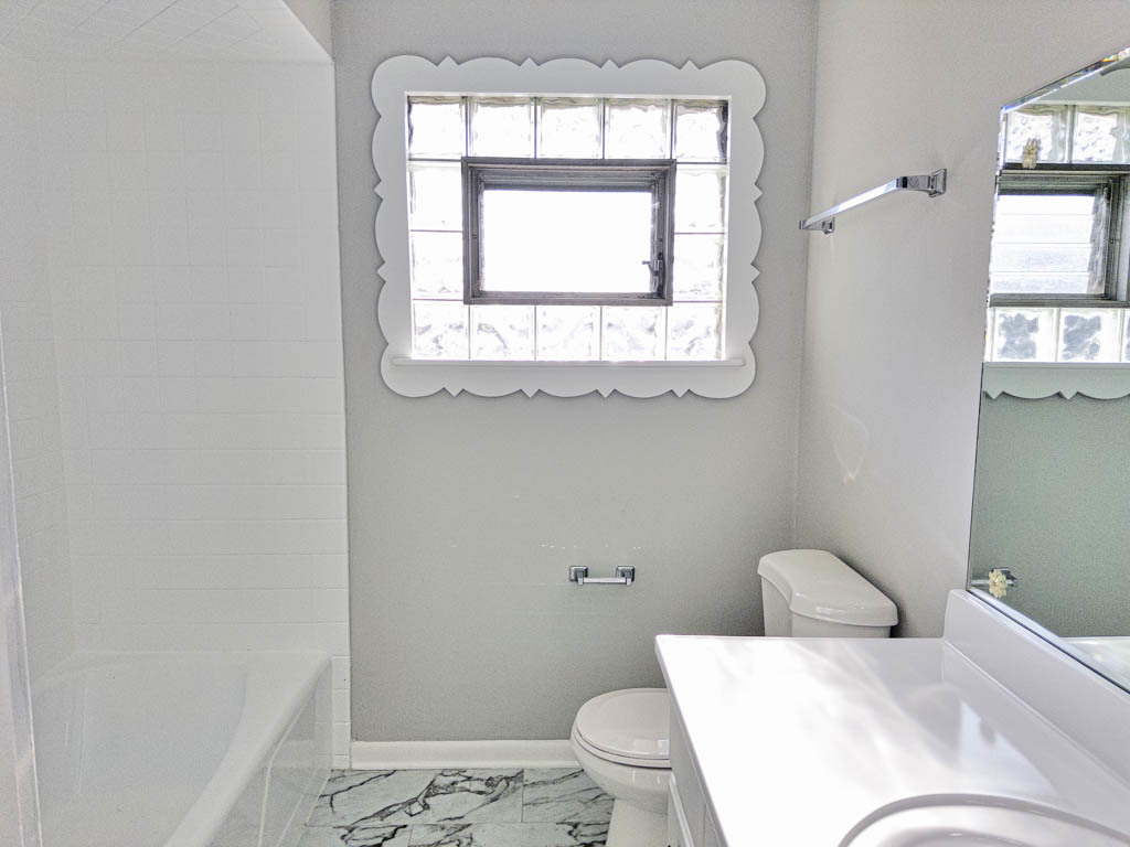 5633 Murray Drive Berkeley, IL 60163 - Photo 10 of 17 a bathroom with a toilet sink and window
