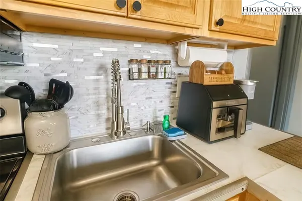 a dining room with furniture and a chandelier