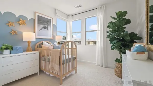 a bed room with furniture and a potted plant