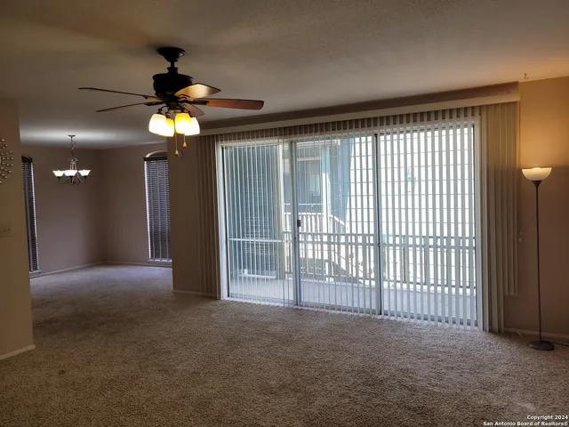 a bathroom with a toilet and a bath tub