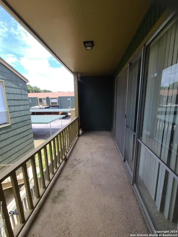 a bathroom with a toilet and a bath tub