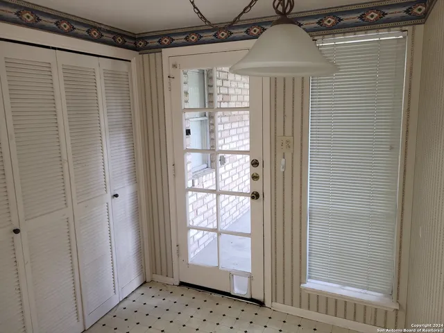 a bathroom with a double vanity sink and a shower