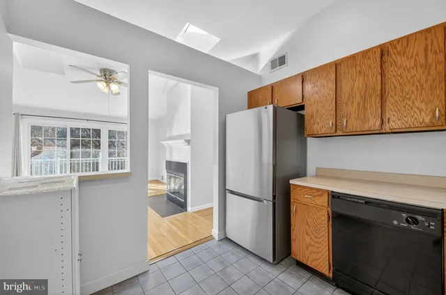 a kitchen with a refrigerator and cabinets