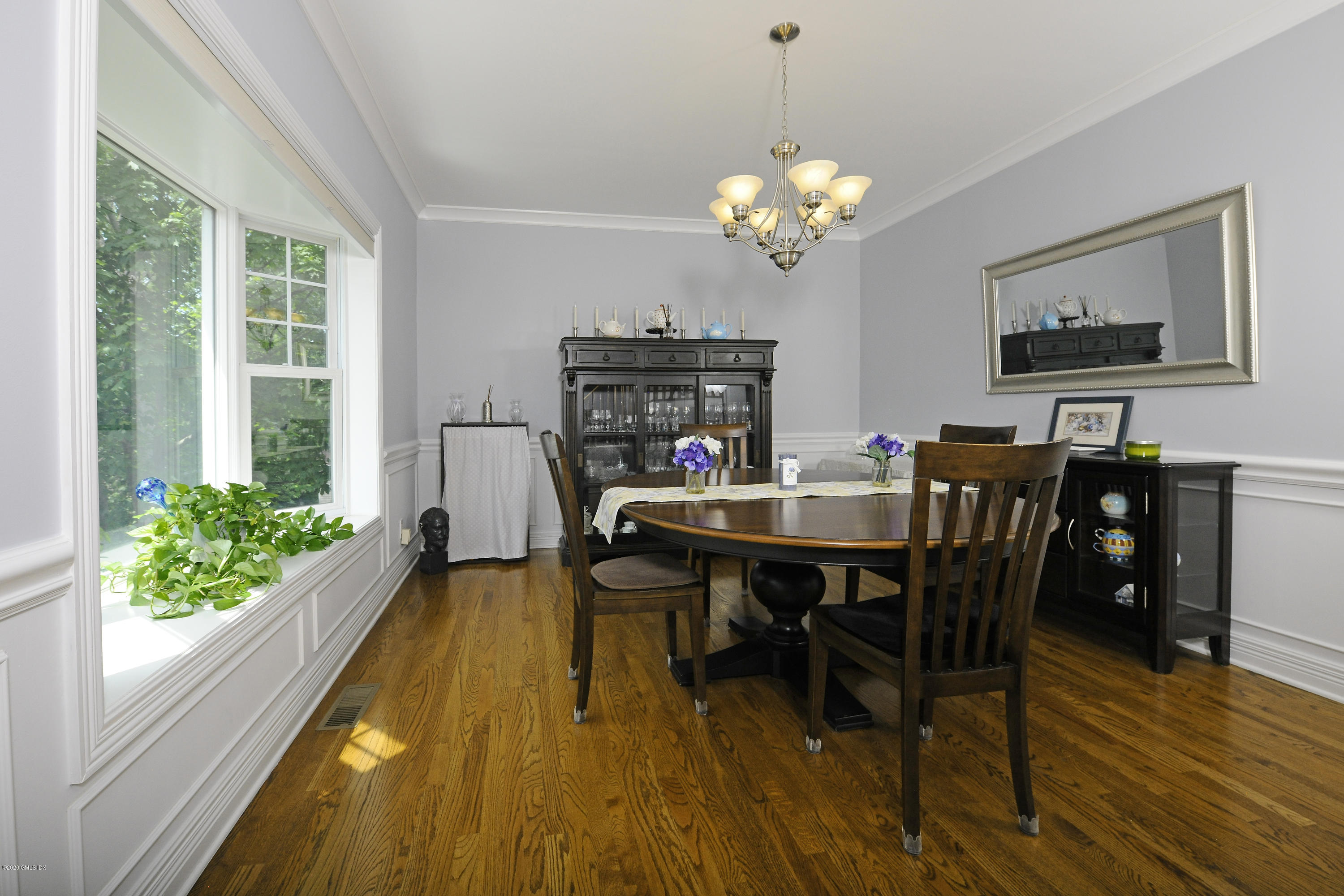 8 View Street, Unit 5 Greenwich, CT 06830 - Photo 12 of 30 a view of a dining room with furniture window and wooden floor