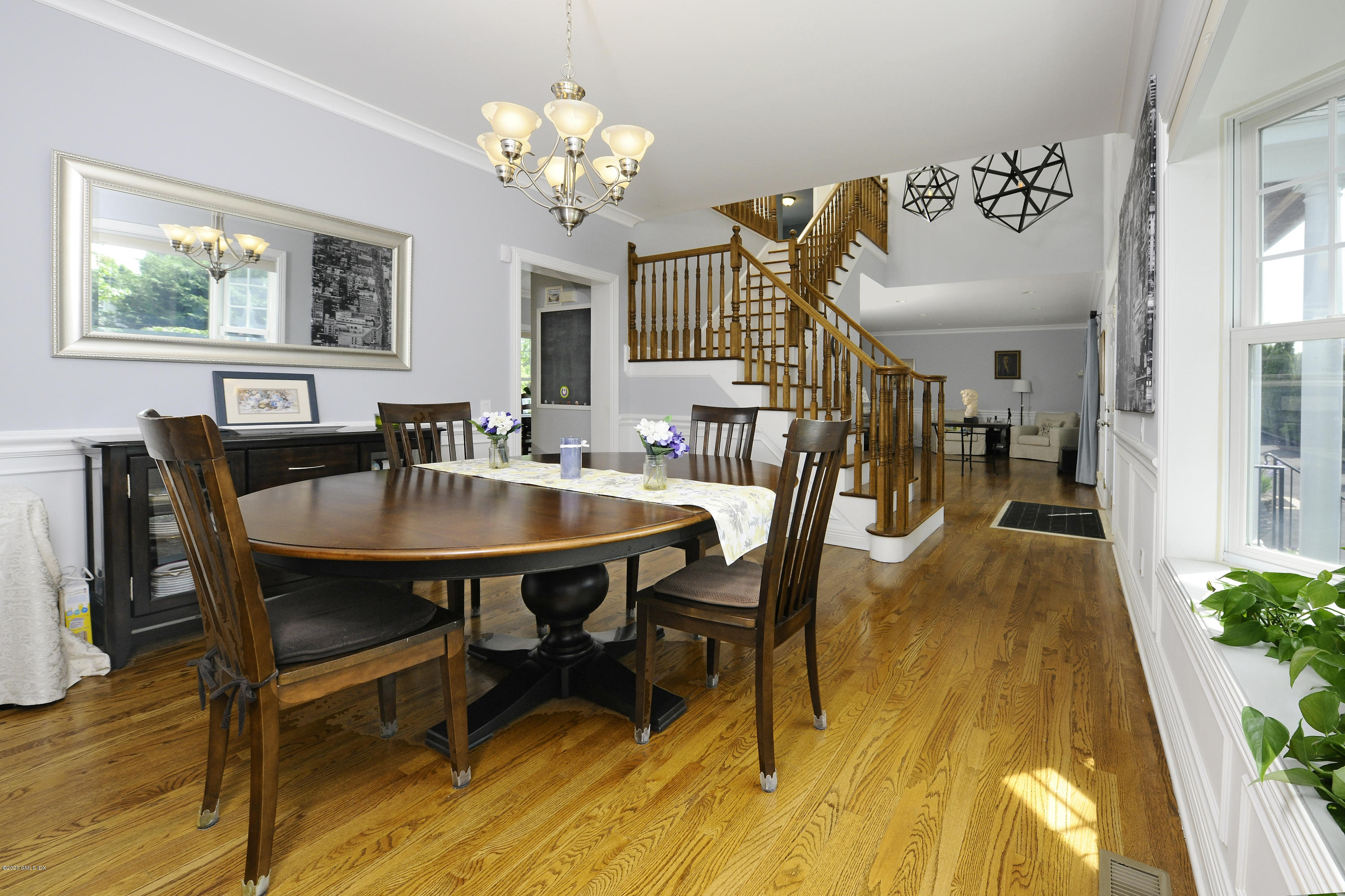 8 View Street, Unit 5 Greenwich, CT 06830 - Photo 13 of 30 a view of a dining room with furniture and chandelier