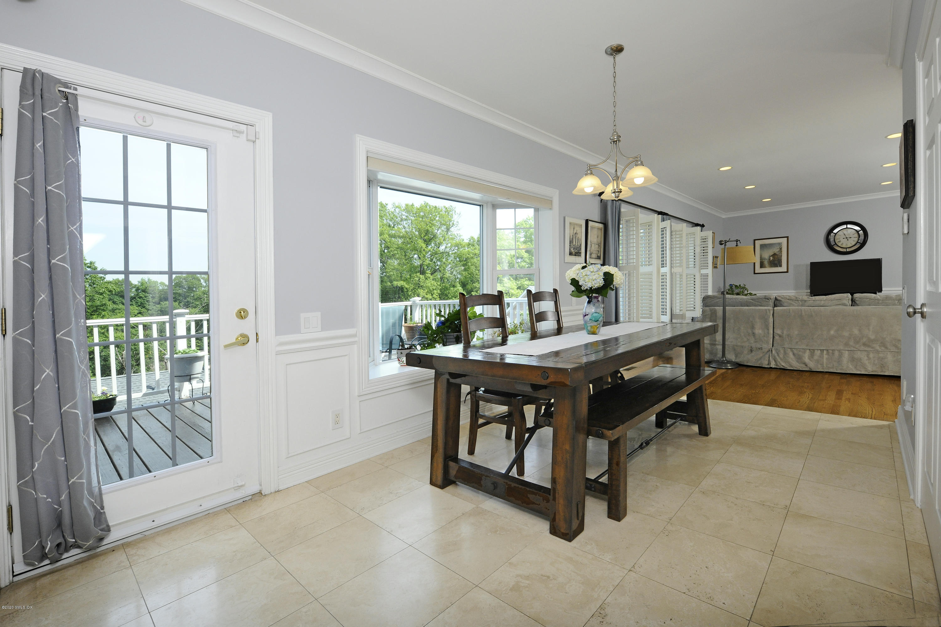 8 View Street, Unit 5 Greenwich, CT 06830 - Photo 14 of 30 a living room with furniture and a large window