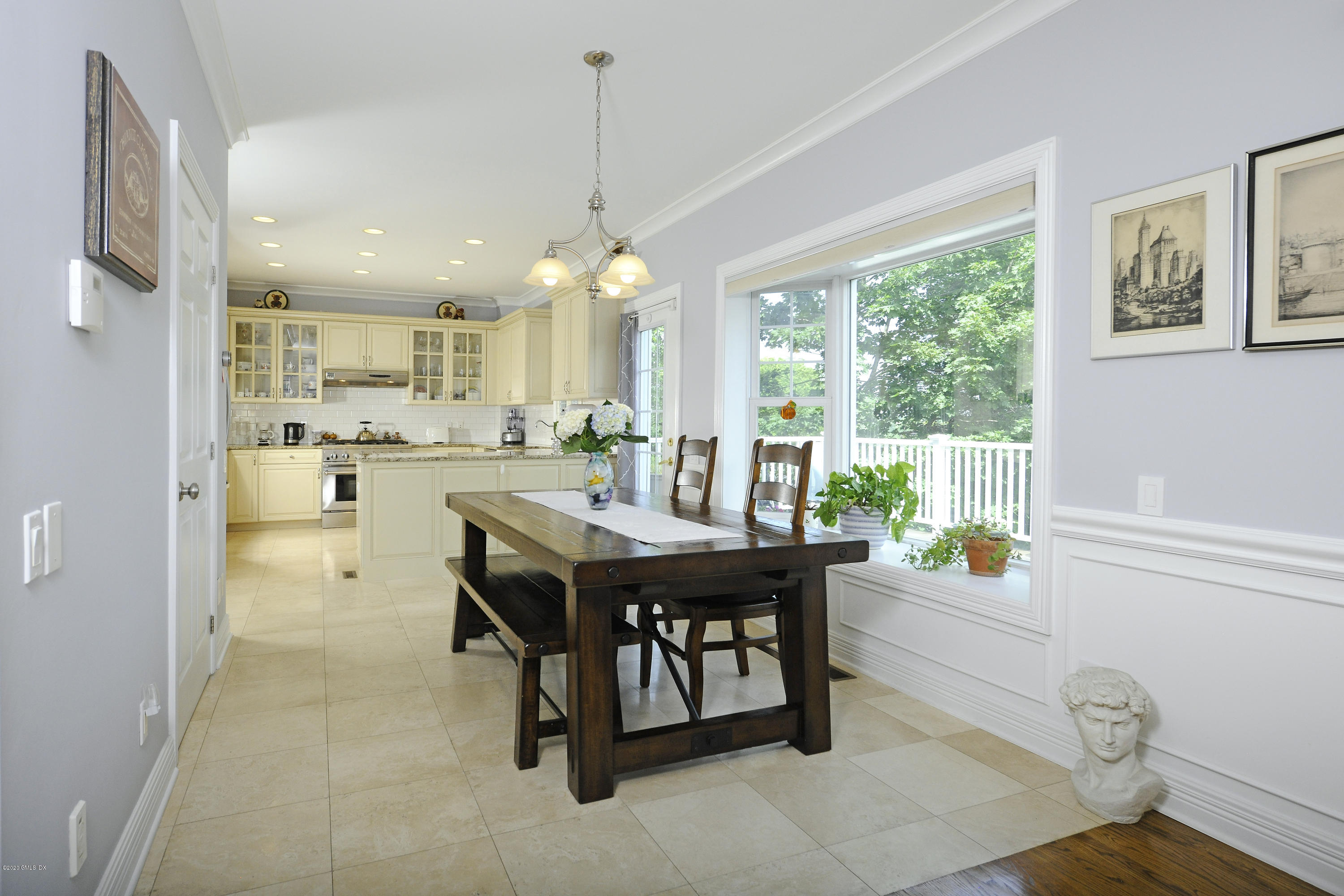 8 View Street, Unit 5 Greenwich, CT 06830 - Photo 15 of 30 a dining room with stainless steel appliances a table and chairs