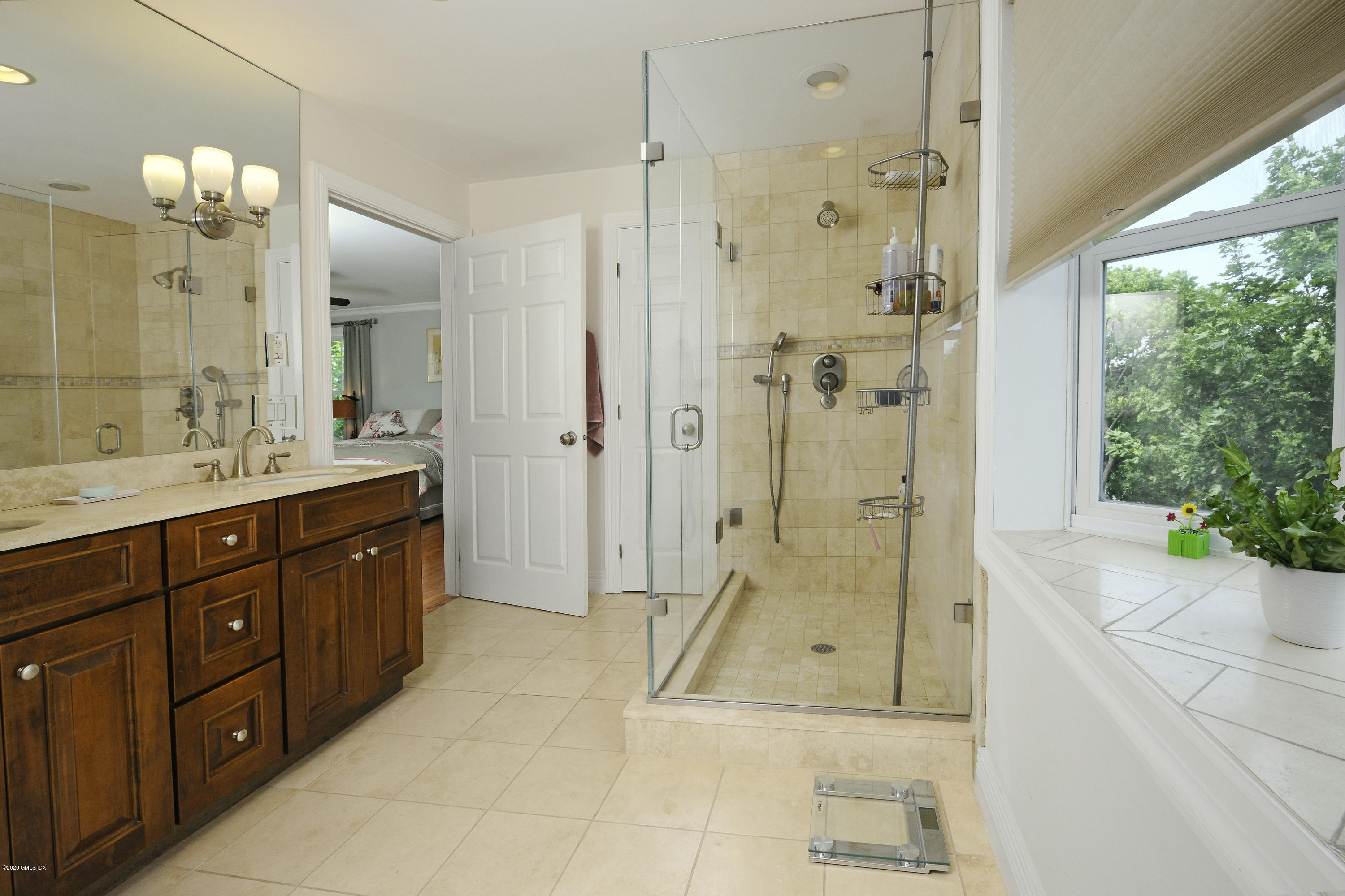 8 View Street, Unit 5 Greenwich, CT 06830 - Photo 20 of 30 a spacious bathroom with a shower sink mirror and