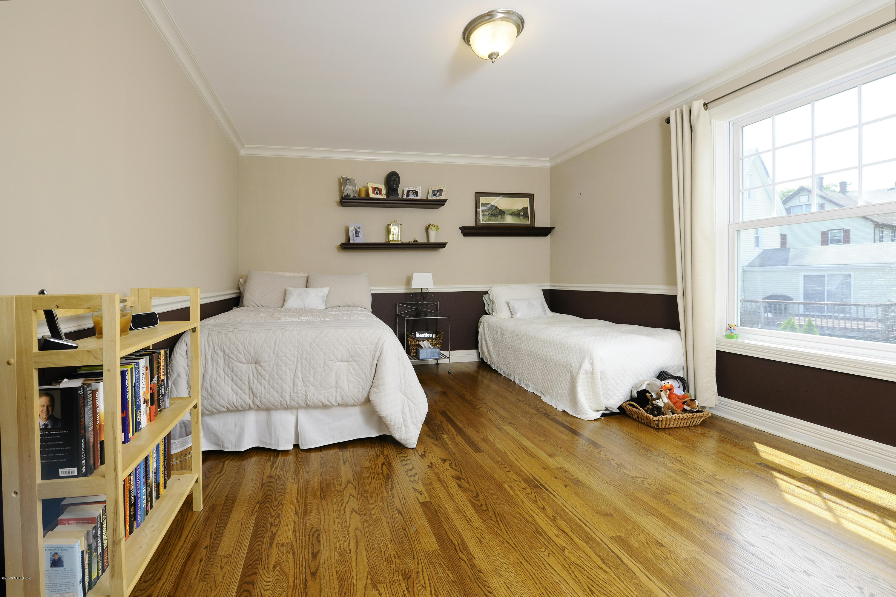 8 View Street, Unit 5 Greenwich, CT 06830 - Photo 21 of 30 a bedroom with furniture and a book shelf