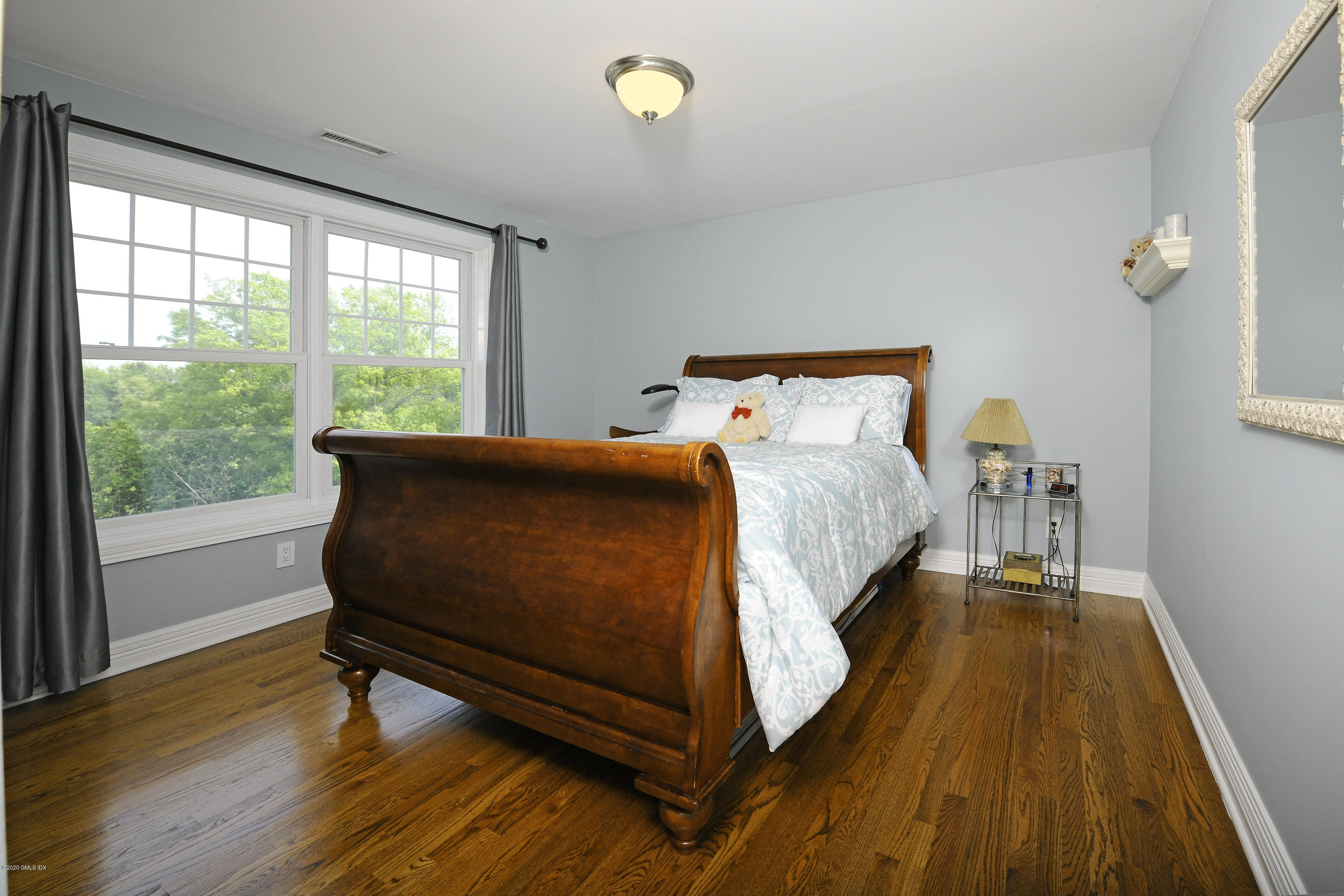 8 View Street, Unit 5 Greenwich, CT 06830 - Photo 22 of 30 a bed sitting in a bedroom next to a window