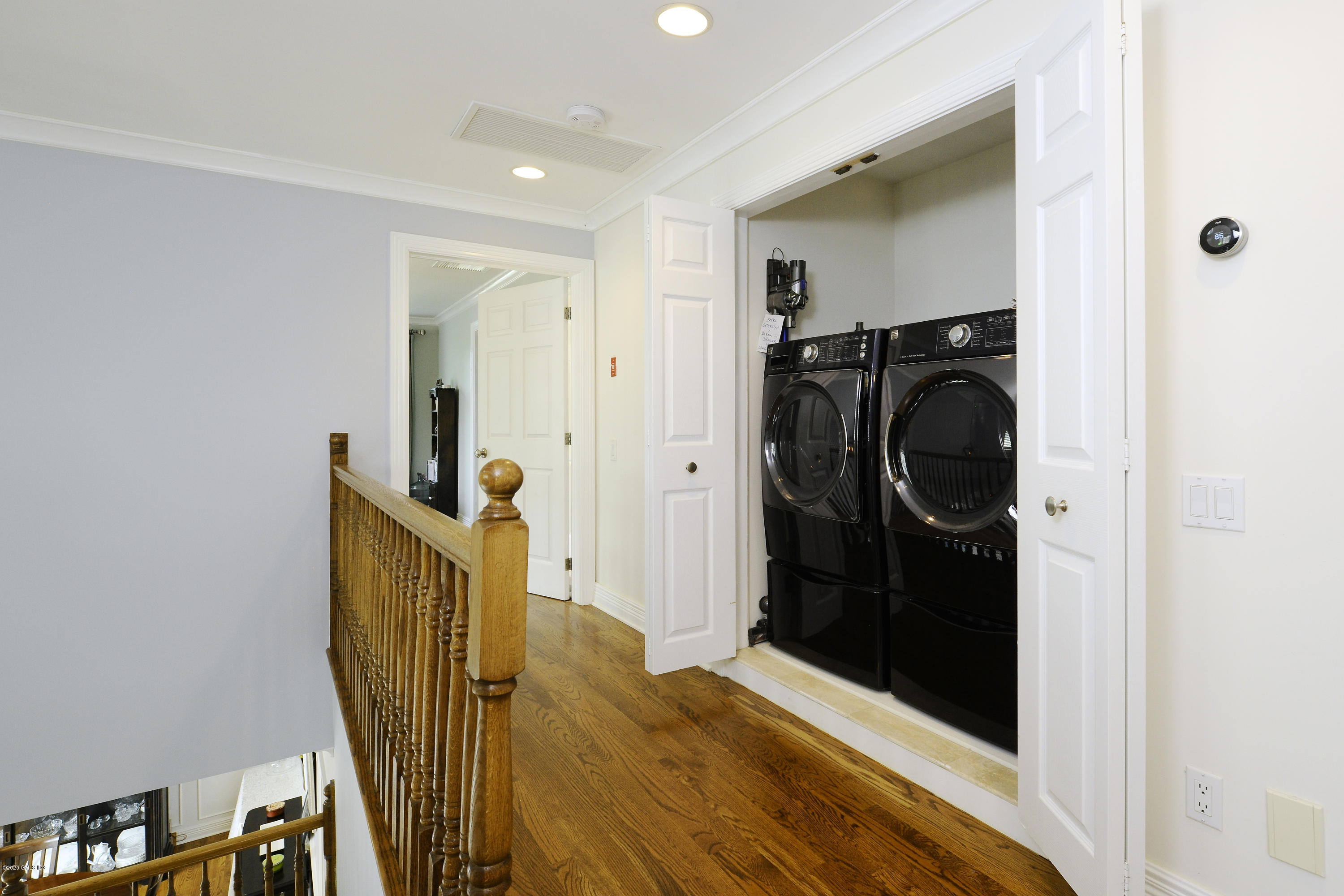 8 View Street, Unit 5 Greenwich, CT 06830 - Photo 24 of 30 a view of a storage & utility room with wooden floor