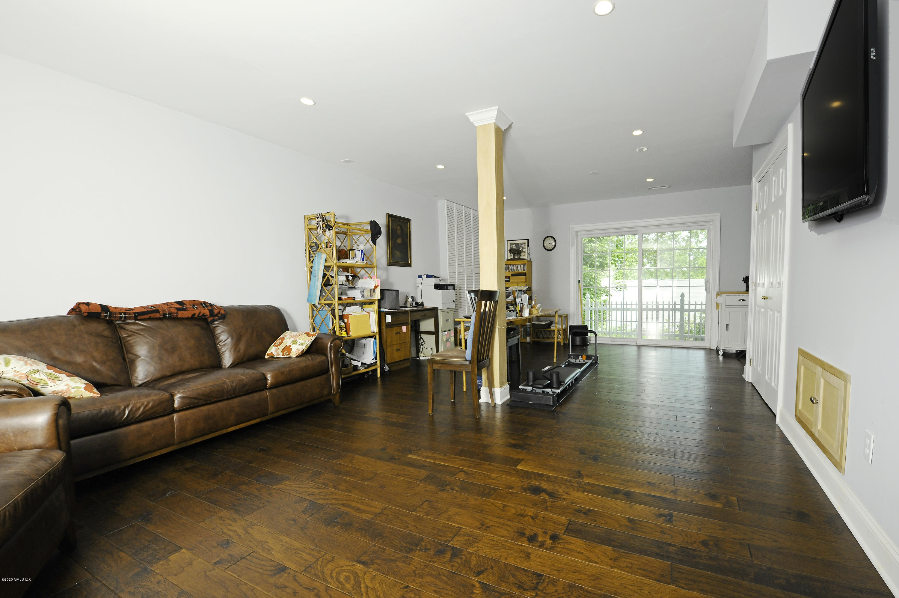 8 View Street, Unit 5 Greenwich, CT 06830 - Photo 25 of 30 a living room with fireplace furniture and a flat screen tv