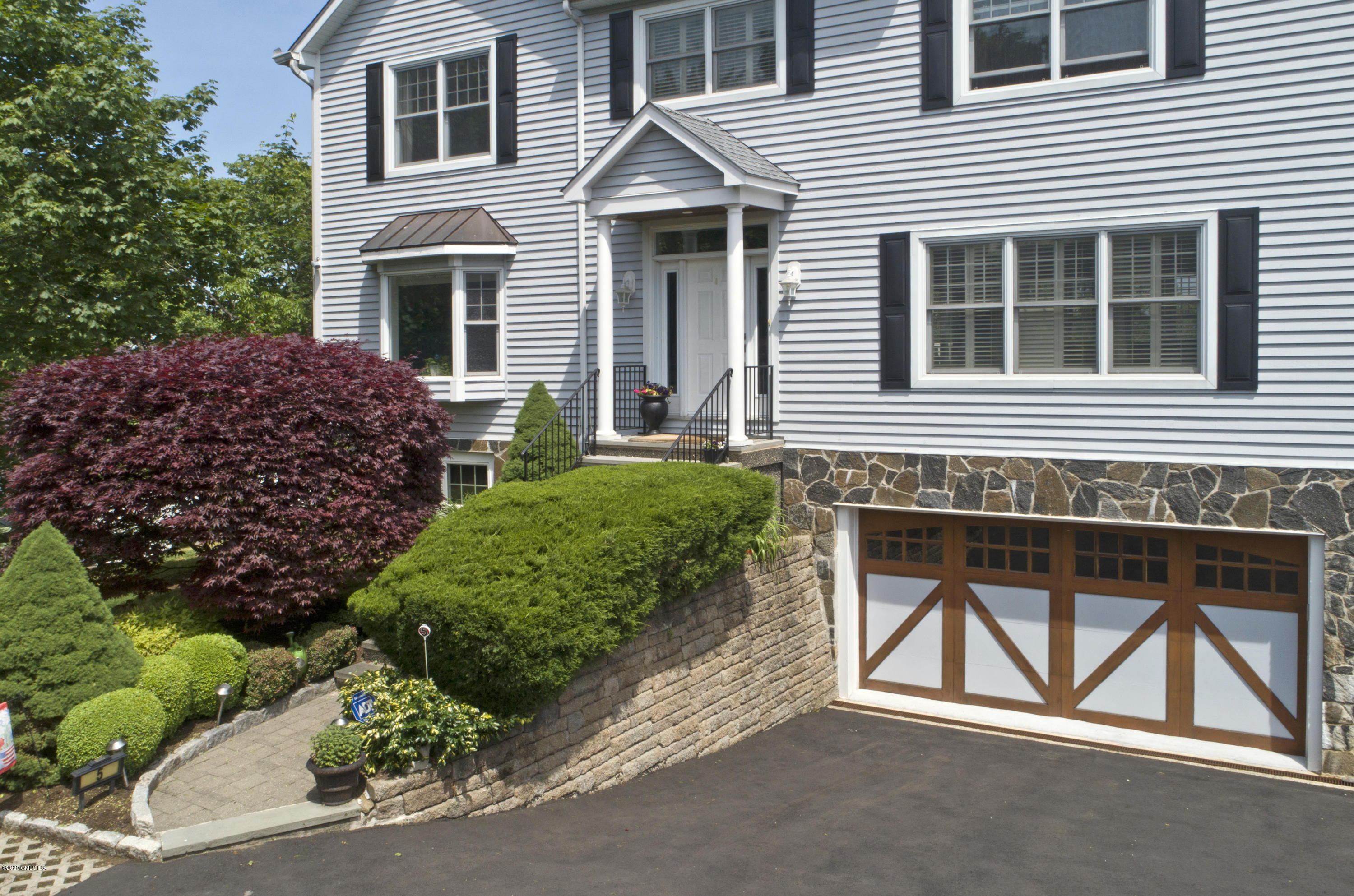 8 View Street, Unit 5 Greenwich, CT 06830 - Photo 4 of 30 a view of house with backyard space and porch
