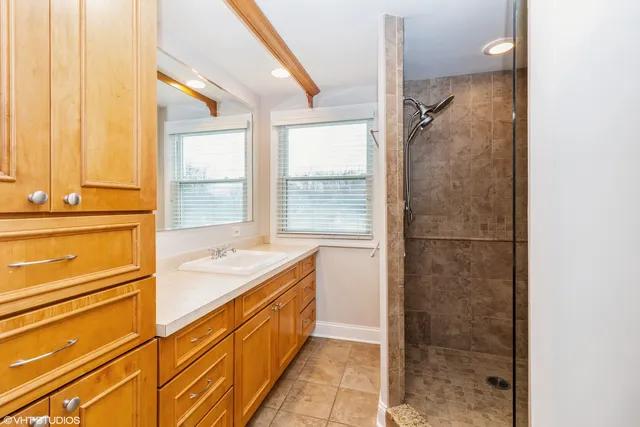 a bathroom with a tub and shower