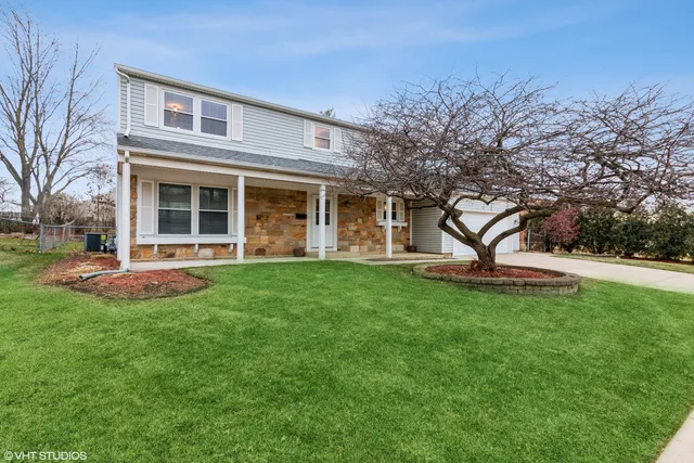 a view of a house with backyard porch and garden