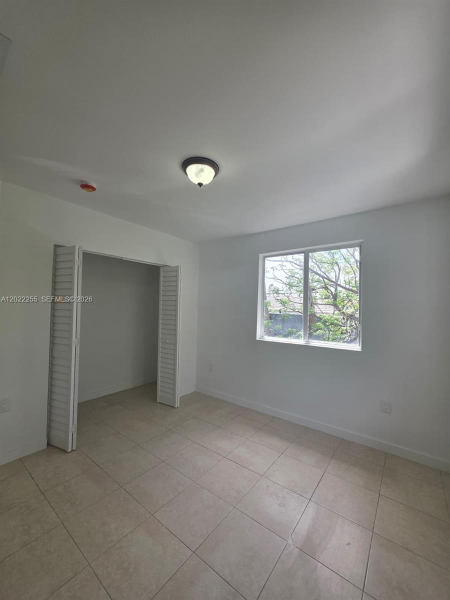 829 Southwest 3rd Street, Unit 831 Miami, FL 33130 - Photo 13 of 21 an empty room with a empty space and windows