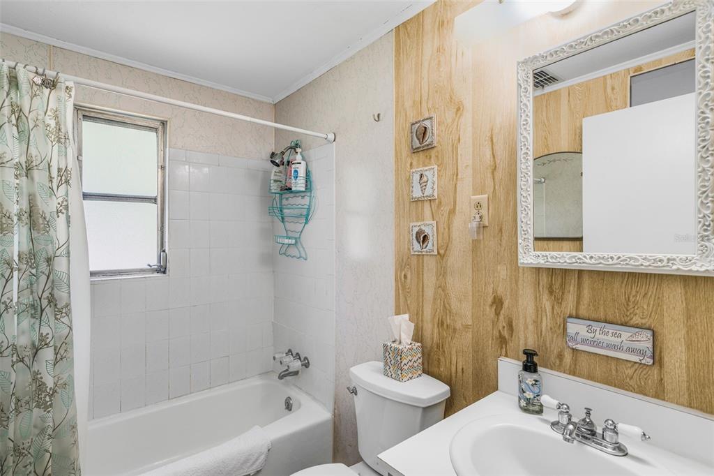 2220 Coon Point Crystal River, FL 34429 - Photo 13 of 58 a bathroom with a bathtub shower sink and toilet