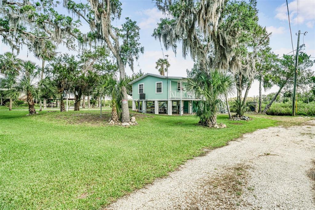 2220 Coon Point Crystal River, FL 34429 - Photo 21 of 58 a view of house with a garden