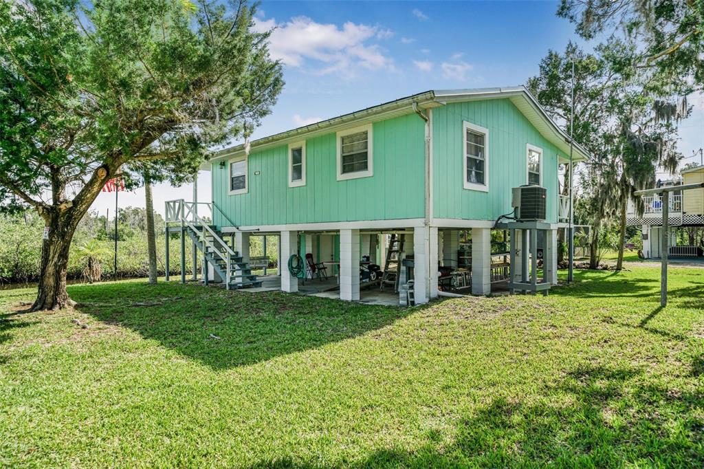2220 Coon Point Crystal River, FL 34429 - Photo 27 of 58 a view of a house with a yard