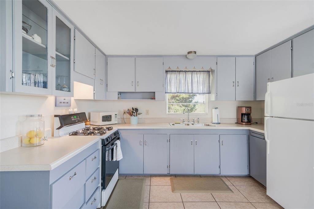 2220 Coon Point Crystal River, FL 34429 - Photo 34 of 58 a kitchen with a sink a stove and cabinets