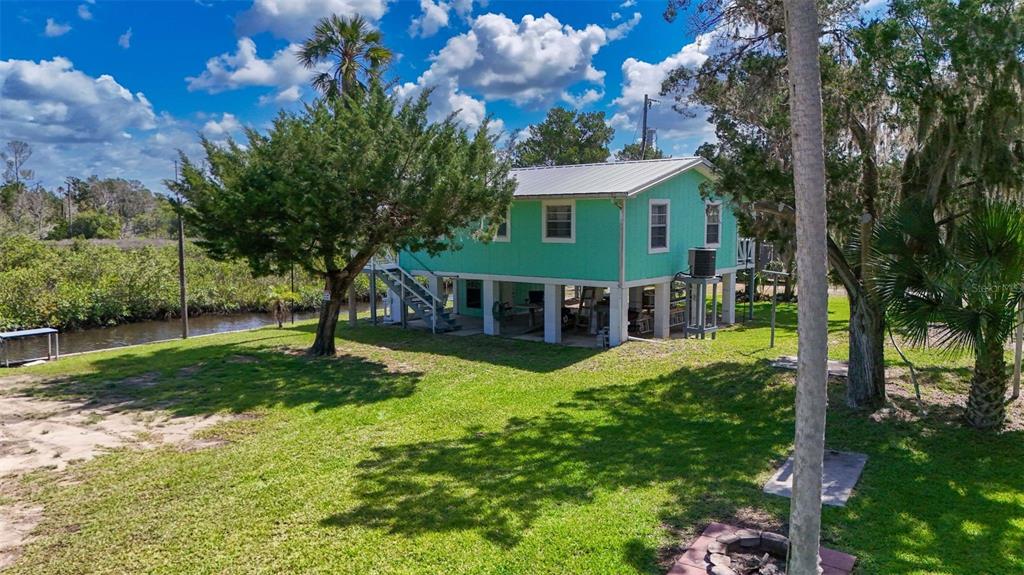2220 Coon Point Crystal River, FL 34429 - Photo 38 of 58 a front view of a house with a yard