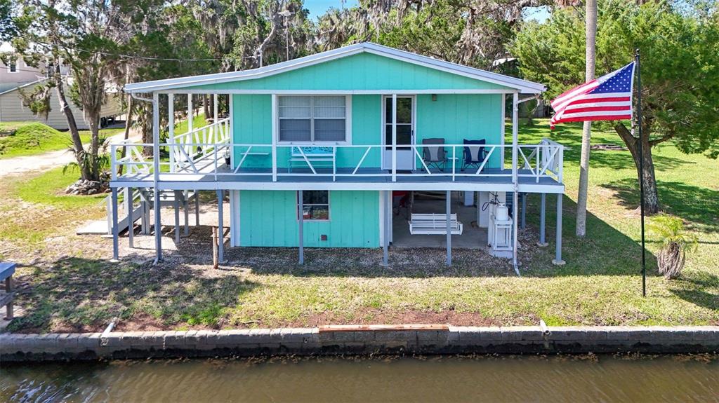 2220 Coon Point Crystal River, FL 34429 - Photo 42 of 58 a front view of a house with a yard